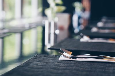 Forks and spoons on restaurant table