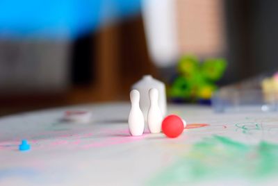 Close up of miniature bowling ball and pins