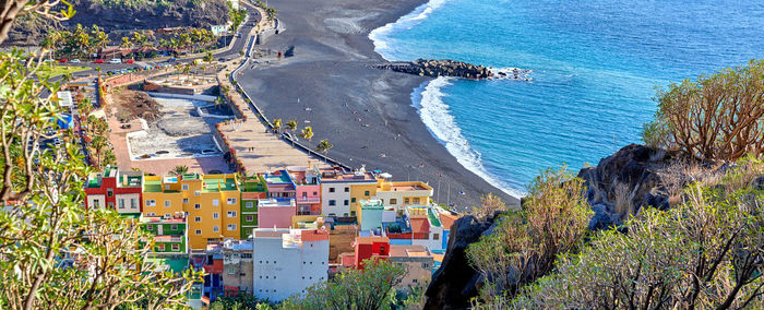 High angle view of townscape by sea