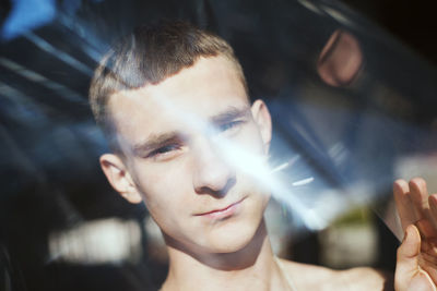 Portrait of young man looking at camera