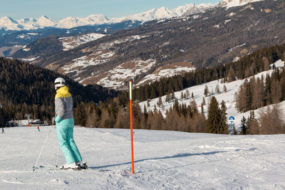 Man skiing on snowcapped mountain