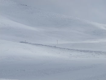 Scenic view of snowy landscape against sky