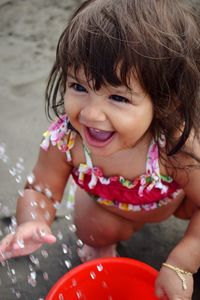 Portrait of a smiling girl with water