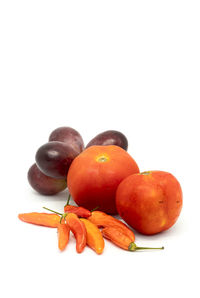Close-up of oranges against white background