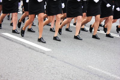 Low section of people walking in city