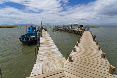 Pier over sea against sky