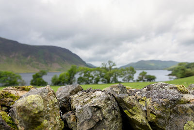 Rocks on mountain against sky