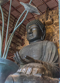 Statue of buddha outside building