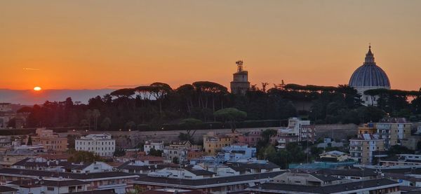 Cityscape against sky during sunrise