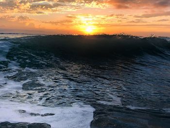 Scenic view of sea against sky during sunset