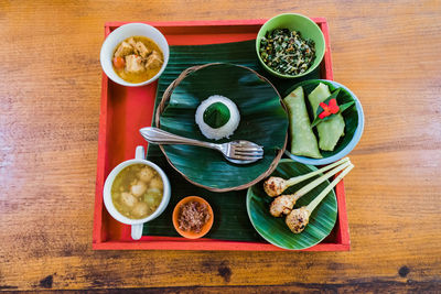 High angle view of different indonesian dishes. 