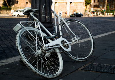 Bicycle parked on sidewalk