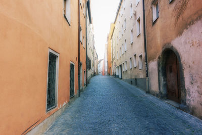 Narrow alley along buildings