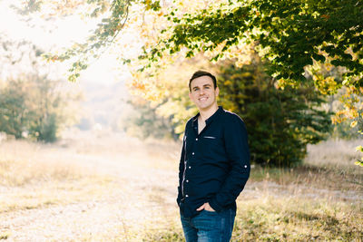 Young man standing on field