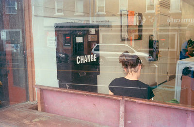 Woman standing in front of building