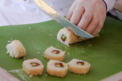 Man slicing sushi