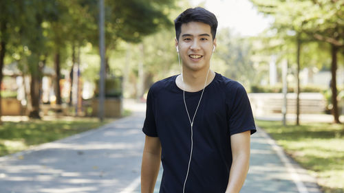 Portrait of a smiling young man in city