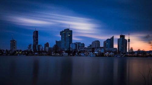 City at waterfront during sunset