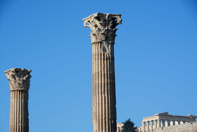 Low angle view of statue against blue sky