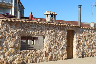 Low angle view of old building against clear sky