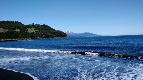 Scenic view of sea against blue sky