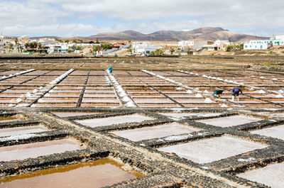 Workers working at salt flat