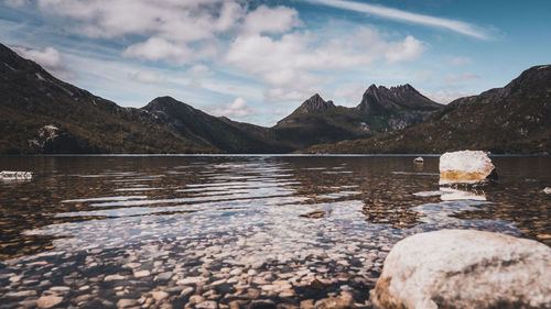 Scenic view of lake and mountains against sky