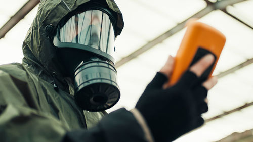 Man with geiger counter in radioactive site