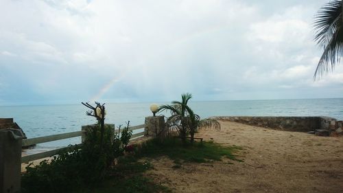 Scenic view of sea against cloudy sky