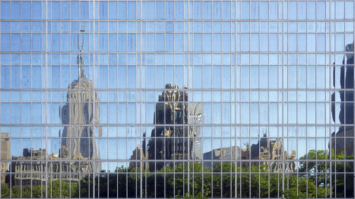 Reflection of buildings on glass in city