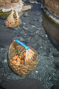 High angle view of wicker baskets with eggs in hot spring pond