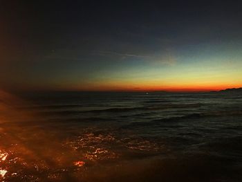 Scenic view of sea against sky at sunset