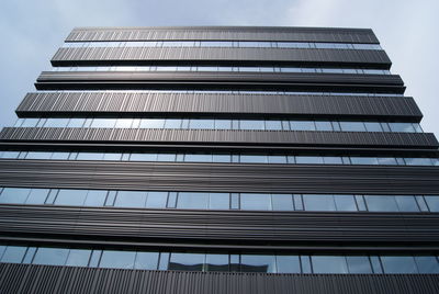 Low angle view of office building against sky