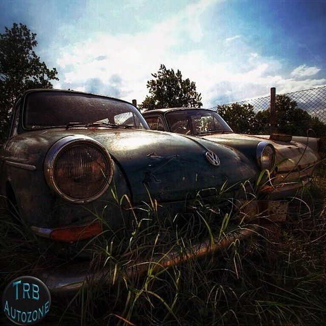 sky, abandoned, land vehicle, obsolete, field, damaged, transportation, old, rusty, cloud - sky, car, no people, cloud, mode of transport, outdoors, day, close-up, tree, grass, deterioration