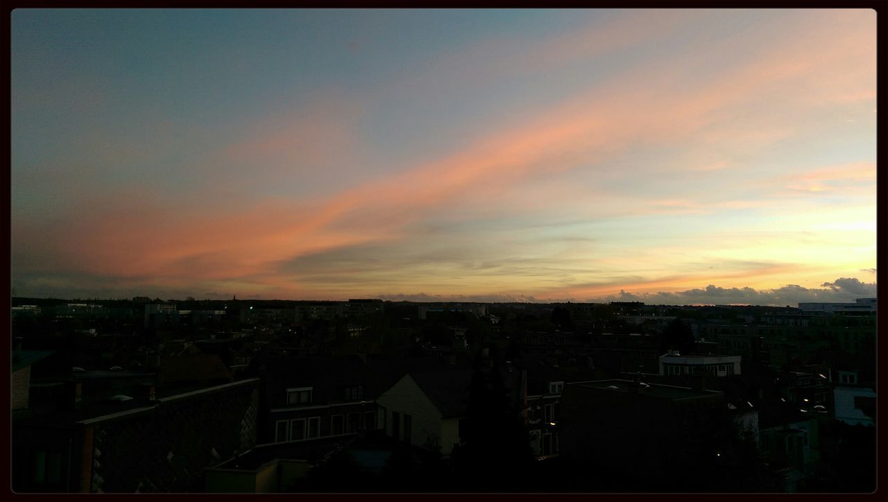 sunset, building exterior, transfer print, architecture, built structure, sky, orange color, cityscape, city, auto post production filter, cloud - sky, crowded, high angle view, residential district, residential structure, residential building, scenics, house, town, dusk