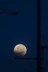 Low angle view of half moon against sky at night