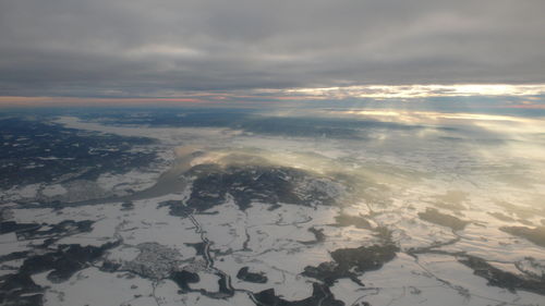 Aerial view of landscape against sky during sunset