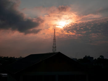 Low angle view of silhouette building against sky during sunset