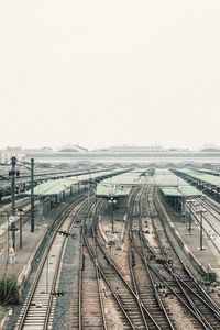 High angle view of railroad tracks against clear sky in city