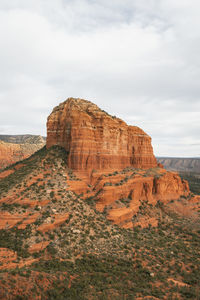 Rock formations on landscape against sky