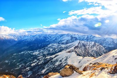 Scenic view of snowcapped mountains against sky