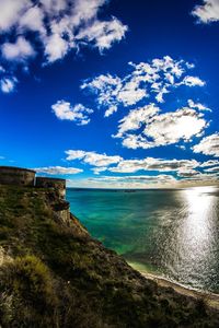 Scenic view of sea against cloudy sky