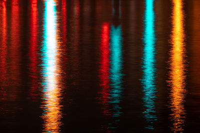 Reflection of illuminated christmas tree