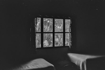 Close-up of window in dark room