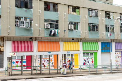 People on street against building