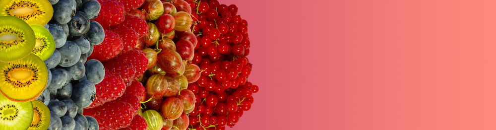 Close-up of fruits against red background