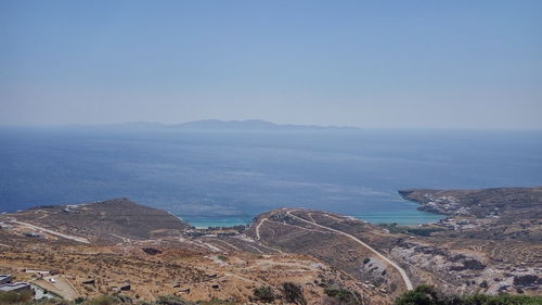 High angle view of townscape by sea against sky