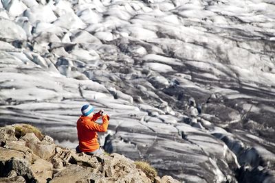 People standing on rock formation