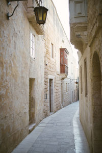 Narrow alley amidst buildings in town