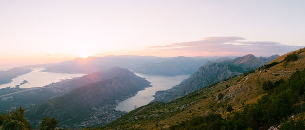 Scenic view of mountains against sky during sunset